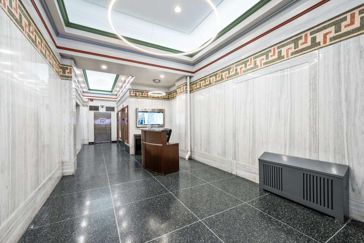 Lobby corridor toward the elevator bank