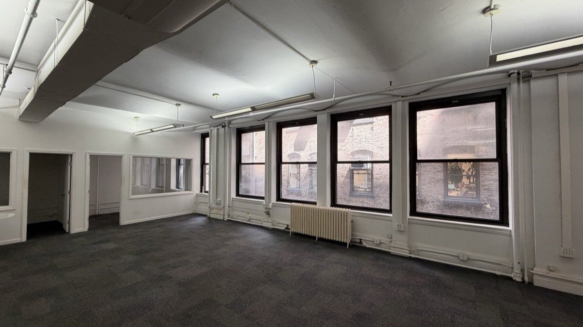 Suite 403 open floor with private office entries