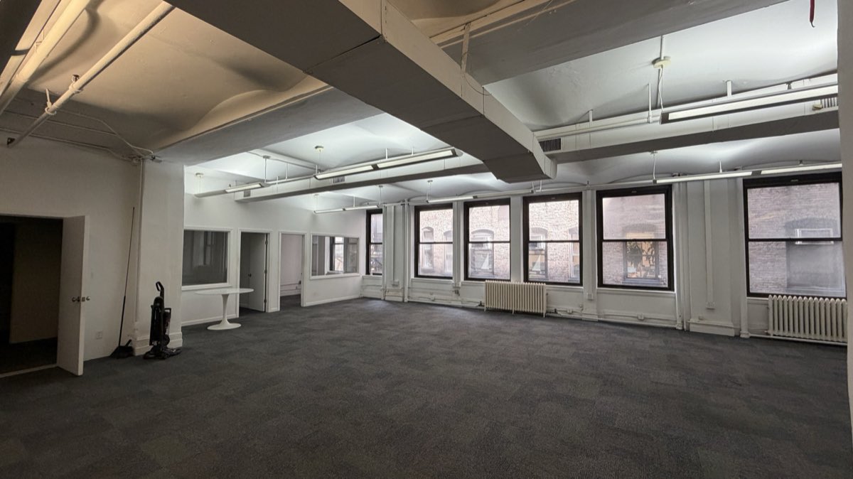 Suite 403 open work area with a run of windows