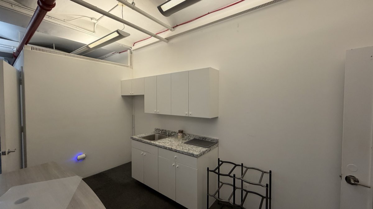 Suite 403 wet pantry with sink and cabinetry